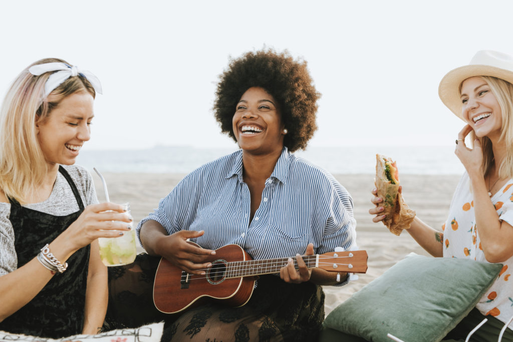 friends-singing-together-at-a-beach-picnic-2022-02-02-05-09-41-utc-1-1024x683